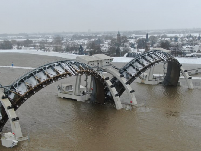 Aerial view of the opened sluice gates of Driel weir on the lower Rhine and the first water to over top the summer levees.